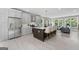 Modern kitchen with stainless steel appliances, an island with seating, and ample cabinet space at 101 Fairfield Nw Pl, Atlanta, GA 30314
