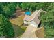 Aerial view of home with large backyard featuring a pool, trampoline, and mature trees at 116 Alexander Dr, Mcdonough, GA 30252