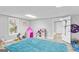 Basement playroom area featuring playful blue carpeting at 116 Alexander Dr, Mcdonough, GA 30252