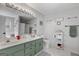 Bathroom with double sinks and green cabinets at 116 Alexander Dr, Mcdonough, GA 30252