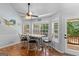 Dining area with natural light, wood floors, and door to the deck at 116 Alexander Dr, Mcdonough, GA 30252