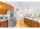 Kitchen featuring stainless steel appliances and a breakfast bar that opens to the dining area at 116 Alexander Dr, Mcdonough, GA 30252