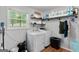 Laundry room with white washer and dryer and window at 116 Alexander Dr, Mcdonough, GA 30252