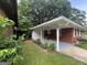 The home has a back entrance with a covered patio and landscaped area at 24 Mobley Se Dr, Atlanta, GA 30315