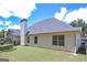 This backyard features a large yard, a chimney, and a partial view of the patio at 170 Saddleridge Dr, Bremen, GA 30110
