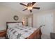 Bedroom featuring a ceiling fan, a view of the bed and bedside table, as well as closet doors at 170 Saddleridge Dr, Bremen, GA 30110