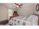 Bedroom with a ceiling fan, carpeted floors, and window with blinds and curtains at 170 Saddleridge Dr, Bremen, GA 30110