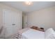 This bedroom has carpet, a closet, and a single bed with a small wooden box on it at 170 Saddleridge Dr, Bremen, GA 30110