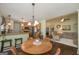 Cozy dining area with seating for four, an open layout, and a view of the living area at 170 Saddleridge Dr, Bremen, GA 30110