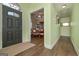 Inviting entryway with dark wood floors leading to dining room with hardwood floors and natural light at 170 Saddleridge Dr, Bremen, GA 30110