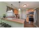 Functional kitchen featuring a breakfast bar, ample counter space, and stainless steel appliances at 170 Saddleridge Dr, Bremen, GA 30110