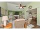 Open-concept living room with a fireplace, mantel, tv, and view to the kitchen and dining room at 170 Saddleridge Dr, Bremen, GA 30110