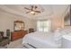 Bright main bedroom with a trey ceiling, carpeted floors and a view of the dresser and chair at 170 Saddleridge Dr, Bremen, GA 30110