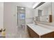 Bathroom featuring a vanity with ample counter space and a separate toilet and shower room at 741 Greenhill Ne Dr, Conyers, GA 30012