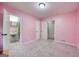 The bedroom is spacious with an adjacent bathroom and neutral carpet at 741 Greenhill Ne Dr, Conyers, GA 30012