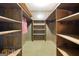 Walk-in closet featuring built-in shelving and storage at 741 Greenhill Ne Dr, Conyers, GA 30012