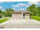 The home has a detached garage with a door and a separate entrance, with a large area for additional parking at 741 Greenhill Ne Dr, Conyers, GA 30012