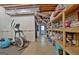 Open basement area featuring exposed ceiling, some storage, and exercise equipment at 115 Shoal Creek Dr, Sharpsburg, GA 30277