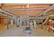 Basement with exposed ceiling, water heater, fireplace and treadmill at 115 Shoal Creek Dr, Sharpsburg, GA 30277