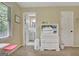 Bright bedroom with carpeted floors, a window for natural light, a closet and a glimpse into an adjacent bathroom at 115 Shoal Creek Dr, Sharpsburg, GA 30277
