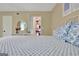 Bright bedroom with carpeted floors featuring a bed, a window with natural light, and an open closet space at 115 Shoal Creek Dr, Sharpsburg, GA 30277