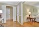 Bedroom suite showing hardwood flooring, ensuite bath, and walk-in closet at 115 Shoal Creek Dr, Sharpsburg, GA 30277