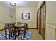 An inviting dining room featuring wainscoting, warm tones, and memorabilia displayed at 115 Shoal Creek Dr, Sharpsburg, GA 30277