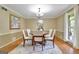 Elegant dining room with a round table and stylish decor at 115 Shoal Creek Dr, Sharpsburg, GA 30277