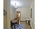 Charming dining room with wainscoting, classic lighting, and a glimpse into the next room at 115 Shoal Creek Dr, Sharpsburg, GA 30277