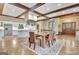 Spacious dining area with a wooden table, seating for six, and stainless appliances at 115 Shoal Creek Dr, Sharpsburg, GA 30277