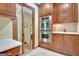 Kitchen features cherry cabinets, stainless steel double ovens, and tile backsplash at 115 Shoal Creek Dr, Sharpsburg, GA 30277
