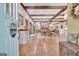 Open living area with dining table, fireplace, and doorway to kitchen at 115 Shoal Creek Dr, Sharpsburg, GA 30277