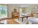 Inviting living room showcasing a piano and natural light at 115 Shoal Creek Dr, Sharpsburg, GA 30277