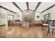 Great room with vaulted ceilings, wood beams, stone fireplace, and rustic decor at 115 Shoal Creek Dr, Sharpsburg, GA 30277