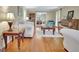 Bright living room featuring hardwood floors and large windows at 115 Shoal Creek Dr, Sharpsburg, GA 30277