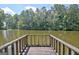 Scenic view of the tranquil pond, offering a serene and peaceful atmosphere at 115 Shoal Creek Dr, Sharpsburg, GA 30277