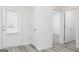 Bright hallway with wood-style flooring leading to other rooms in the home at 435 Prescott Way, Villa Rica, GA 30180