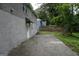 Back exterior view of home featuring a concrete patio, fence, and trees at 39 Mcferrin Cir, Riverdale, GA 30274