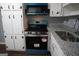 The kitchen features white cabinets, dark hardware, stainless appliances and gray countertops at 39 Mcferrin Cir, Riverdale, GA 30274
