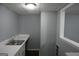 Laundry room featuring a sink and ample counter space and large window at 39 Mcferrin Cir, Riverdale, GA 30274