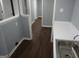Laundry room featuring a sink and ample counter space, white trim, and modern gray walls at 39 Mcferrin Cir, Riverdale, GA 30274