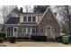 Charming brick Tudor-style home with manicured landscaping and a cozy, inviting entrance at 1270 M L King Jr Sw Dr, Atlanta, GA 30314