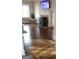Bright living room with hardwood floors, a decorative fireplace, and large windows at 1270 M L King Jr Sw Dr, Atlanta, GA 30314