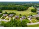 Aerial view of multiple homes and surrounding golf course and mature trees at 713 Birkdale Blvd, Carrollton, GA 30116