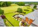 Amazing backyard view showcasing lush greenery, a pool, and golf course access at 713 Birkdale Blvd, Carrollton, GA 30116
