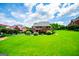 Large backyard features well-maintained lawn, volleyball net and patio at 713 Birkdale Blvd, Carrollton, GA 30116