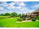 Beautiful backyard features a well-maintained lawn, black fence and a volley ball net at 713 Birkdale Blvd, Carrollton, GA 30116