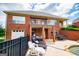 Brick home with a covered patio area, lounge chairs, and access to the pool at 713 Birkdale Blvd, Carrollton, GA 30116