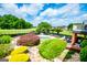 Backyard with a stunning pool, lush greenery, and meticulously landscaped bushes, creating a serene outdoor retreat at 713 Birkdale Blvd, Carrollton, GA 30116