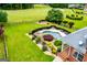 The backyard view shows a stunning pool area, lush greenery, and ample space at 713 Birkdale Blvd, Carrollton, GA 30116